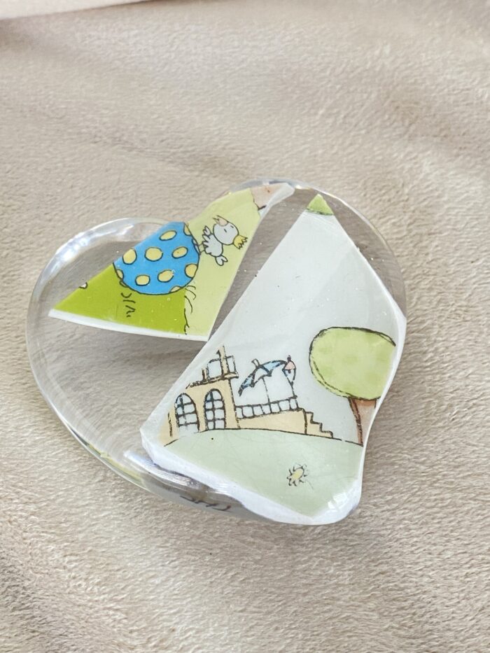 Variante vom Handschleichler mit dem zerbrochenen Kinderteller als Andenken an die Kleinkind - Zeit.